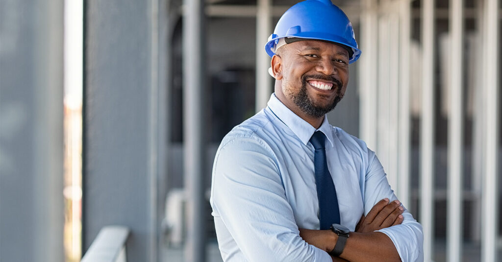 Man in Hardhat on Balcony