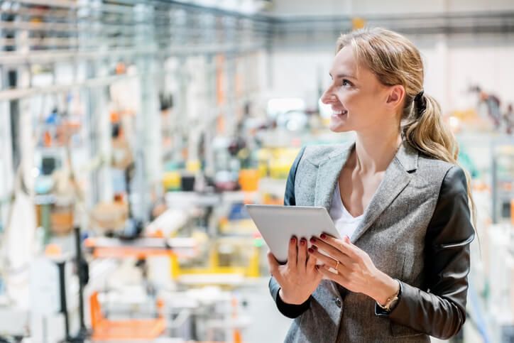 Woman using Tablet on Shop Floor