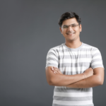 Man with Glasses in a Gray and White Stripped Shirt