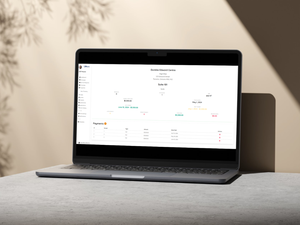 Laptop on Desk showing Rental Details Screen with Payments
